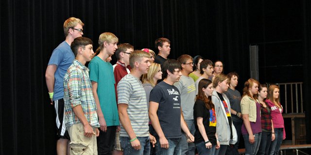 Moffat County High School choir students pause Monday as they take direction from theater and choir teacher Heather Dahlberg, not shown, during a rehearsal in the high school auditorium. Craig Middle School choir students will join MCHS singers onstage at 7 p.m. Tuesday for “I’ve Got the Music In Me,” the final choir concert of the school year.