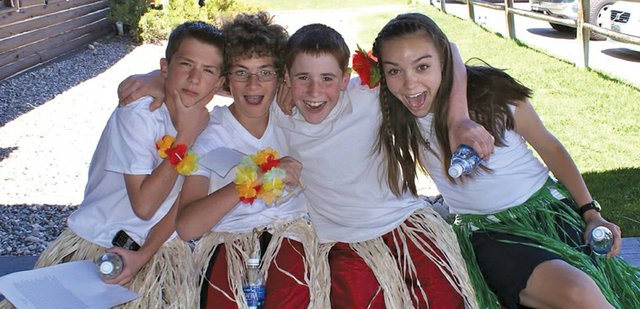 From left, Craig Middle School eighth-grader Wes Atkin and seventh-graders Zach Soron, Wyatt Bellio and Marie Bolton pose for a photo outside of Olympian Hall in Steamboat Springs during a Colorado Model United Nations conference May 9 and 10. The event, the first of its kind in Northwest Colorado, required students to tackle social, environmental and economic problems in other countries.