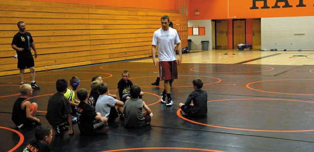 All-American wrestler Joe Leblanc speaks to local youth wrestlers during a camp Saturday at Hayden High School. Leblanc, a Meeker native, graduated from the University of Wyoming in May and has accepted a job to become the Indiana University assistant wrestling coach. He showed wrestlers basic, important techniques and also spoke about the importance of a good work ethic.