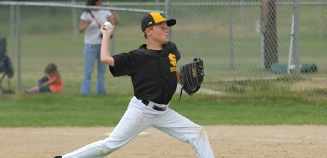 A pitcher for the Sandlot Bees throws during the team’s Triple Crown baseball game in the Steamboat Mountain Magic Triple Crown Baseball tournament at Loudy-Simpson Park Friday. A record 87 teams attended the tournament this year, and games were played in Craig, Hayden, Steamboat Springs and Oak Creek. The finals of the tournament will be Sunday in Steamboat Springs.