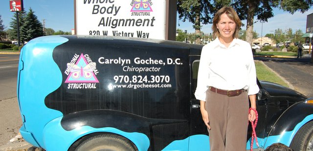 Carolyn Gochee and her mastiff, Maya, head out for the day in the parking lot of Whole Body Alignment. Gochee, 35, is a chiropractor who has lived in Craig since 2004. The car pictured is a refurbished 1969 Volkswagen, which she uses to promote her practice, and the logo on it is a butterfly detailing the state of growing bodily health.
