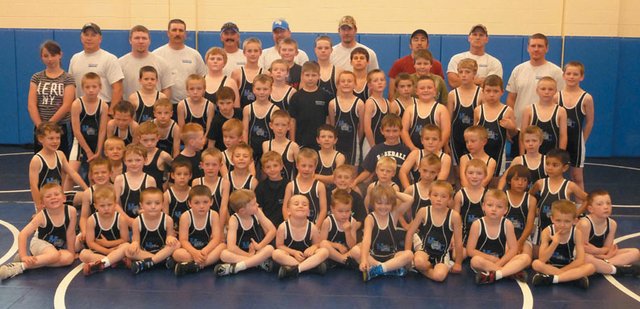 The Moffat County Youth Wrestling team and coaches pose for a picture. The team had its first season ever this spring and had 78 members sign up. Its coaches are made up of former Moffat County High School wrestlers. The team is pictured with the coaches, top row from left, Steve Durbin, Jeremiah Noland, Mark Voloshin, co-founder Chad Lawton, Chad Marshall, Neil Call, Anton Fredrickson, co-founder Mark Zimmerman and Phil Vallem. Coaches not pictured are Clint Haskins, Kurtis Kostur, Greg Hixson, Kip Hafey and Travis Linscum.