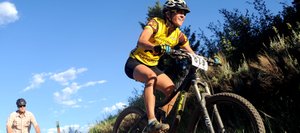 Mindy Mulliken flies off a jump Wednesday at the Town Challenge Mountain Bike Race on Emerald Mountain in Steamboat Springs. The event drew nearly 200 riders.