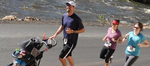 Runners head down River Road alongside a surging Yampa River during the 2011 Mountain Madness half-marathon and 10-kilometer race in Steamboat Springs. The scenery will be a bit different Sunday, when the race returns. The river is but a trickle, but a large field again is expected.