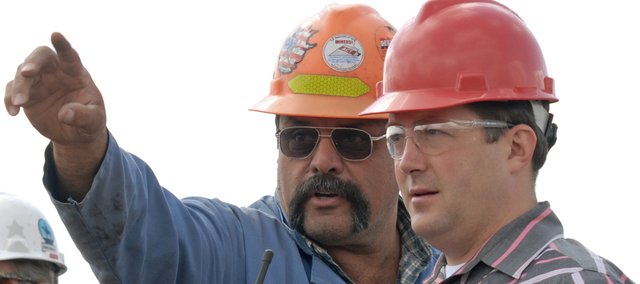 Trapper Mine employee Doug Schneider, left, explains to Sal Pace, a Pueblo Democrat running for Colorado’s 3rd Congressional District, where dynamite has been laid during a blast demonstration at Trapper Mine in Craig. Pace visited with Trapper Mine officials as part of a seven-day, 23-stop listening tour of 3rd Congressional District.
