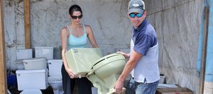 Travis and Deanna Mathey pick out a toilet Wednesday near the Milner Landfill that will be used in the Routt County Redneck Olympics on Saturday in Hayden.