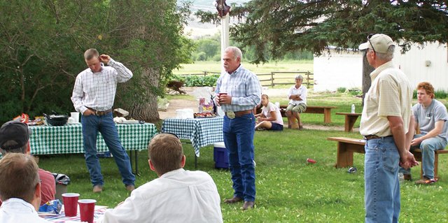 Terry Jost, center, Yampa Valley rancher and president of Mountain Valley Bank, talks Tuesday at Carpenter Ranch near Hayden about the affects this summer’s drought have had on both his personal ranching operation as well as on the financial side of the industry. Standing with him are Lee Curby, left, who leases land with Jost on Carpenter Ranch, and Geoff Blakeslee, manager of Carpenter Ranch.