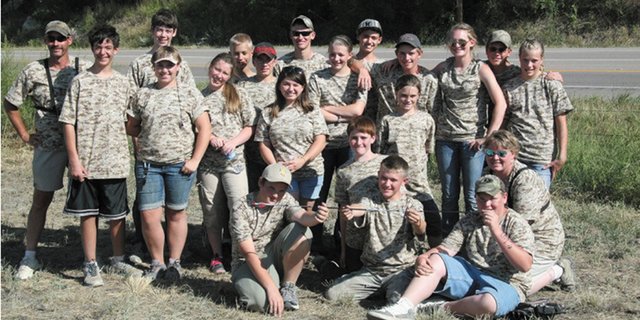 The Moffat County 4-H Club Sliver Slingers archery team poses at the Colorado State Archery Shoot in Pueblo Aug. 19. The team had it's best year ever at the competition, winning the junior compound bow unlimited division, coming in third in the senior compound bow unlimited division, and fifth in the junior compound bow limited division.
Kneeling (from left): Casey Copeland, Zachary Soron, Sam Walls, Cutter Polly, Sarah Polly (coach)
Front row (from left): Tatam Hickman, Kimber Wheeler
Middle row (from left): Ben Pugh, Ciara Hickman, Kyla Pogline, Tracer Hickman, Brittany Schulze, Jordan Kainz, Tiffany Schulze, Jaci McDiffett
Back row (from left): Shawn Polly (coach), Nick Pugh, Jacob Briggs, Justin Willems, Steven Walls, Travis Walsh