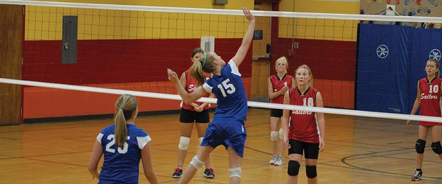Jana Camilletti tips the ball over the net during the first set of Saturday's game vs. Steamboat Springs at Sandrock Elementary School. The Craig Middle School seventh-grade A Team lost to Steamboat in three sets. Both seventh grade teams from CMS were playing in new uniforms. The jerseys were bought with a donation from Twentymile Mine and made by Chaos Ink, while the shorts were bought by the Moffat County Athletic Department and came from Hibbett Sports.