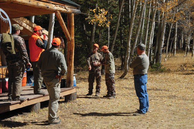 Writers and Editors from national hunting magazines, including Brad Fenson of North American Hunter (speaking), Adam McKean of Outdoor Life Magazine (right of Fenson) and Mike Schoby of Petersen's Hunting Magazine (in foreground), came to Craig earlier this month to go elk hunting with Elkhorn Outfitters. They hunted at Elkhorn's Pilot Camp.