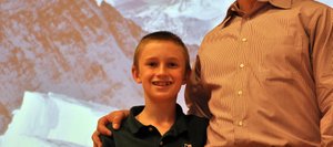 Bowden Tumminello, left, was excited to have his dad, Doug, at Heritage Christian School on Monday to talk about his 2006 summit of Mount Everest.