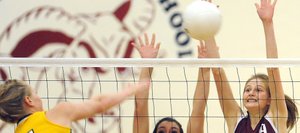 Soroco's Billie Bratton, left, and Josie Rossi go up for a block Saturday against North Park. The Rams lost the match in four sets. They return to action Friday in the district tournament.