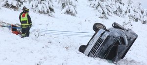 Firefighters preparing to move the truck that rolled down an embankment Thursday morning in Steamboat.