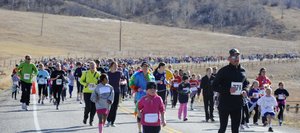 Runners come down Amethyst Drive during the Girls on the Run 5-kilometer running event Saturday. The run started at Steamboat Springs Middle School.