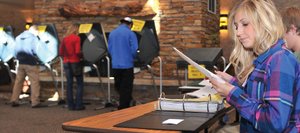 Election judge Maddy Globe waits to register another voter at the Mountain Resorts building polling place in Steamboat Springs midday Tuesday. Officials there said they've seen a steady flow of voters through the first part of the day, but no significant lines have been reported at any Routt County precinct location.