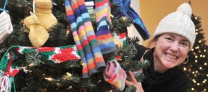 Candice Bannister, executive director of the Tread of Pioneers Museum, peeks out from behind the “Giving Tree,” which was decorated by LIFT-UP of Routt County for this year’s Festival of Trees. The annual Tread of Pioneers Museum fundraiser is scheduled to run Saturday through Nov. 19 this year, and is open and free to the public from 11 a.m. to 5 p.m. every day.