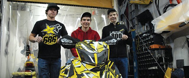 From left: Wesley Chapman, 18, Austin Gabbert, 18, and A.J. Stoffle, 14, stand with Gabbert's Snocross sled. The Craig residents and Snocross competitors started driving today for the International Series of Champions season kickoff in Duluth, Minn. They will race Nov. 23-25, and race throughout the winter around Colorado and Wyoming.
