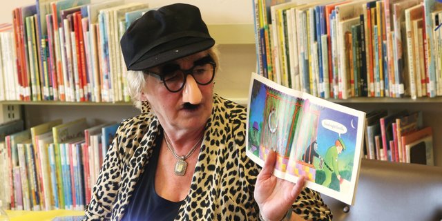Kay Bivens shines her flashlight in costume while reading “Good Night, Gorilla” on November 14 during a story time launch of Dolly Parton’s Imagination Library at Meeker Public Library. As of November 16, a total of 120 children in Rio Blanco County and 165 children in Moffat County had enrolled in the program.