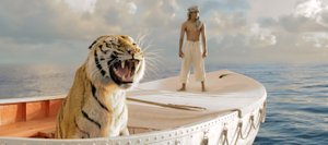 Pi Patel (Suraj Sharma) and his feline traveling companion Richard Parker survey the emptiness of the ocean in “Life of Pi.” The movie is about an Indian teenager who survives a shipwreck and must live for weeks alone on a lifeboat with an adult Bengal tiger.