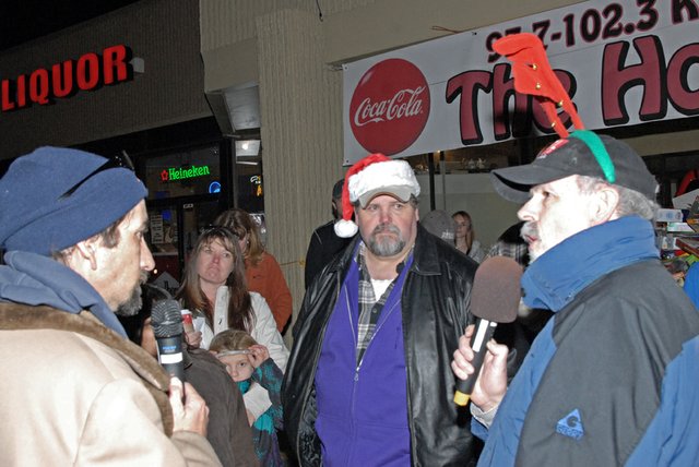 Frank Hanel, right, and Mike Fuller, of KRAI and 55 Country, prepare to announce the results of this year's Holiday Drive. The two-day fundraiser netted more than $25,470 in cash, 4,580 pounds of food and more than 1,700 toys to benefit local charity organizations, making it the second best Holiday Drive in history.
