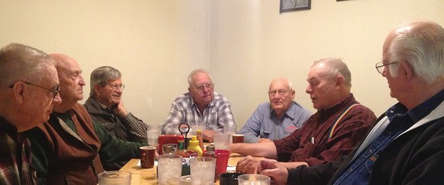 A group of Craig men listen to a story from Lou Wyman (middle-right) over coffee and tea in the back room at the Coolwater Grille. The group has shared stories over coffee for years, first at the Golden Cavvy and now at Coolwater. Starting front-left: Dean Visintainer, Bill Rippy, Neil McCandless, Paul Kawcak, Al Shepherd, Wyman and Fred Shaffer are all regulars. Dean Jent is another common face not pictured here.