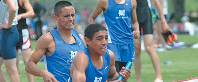 Alfredo Lebron takes a baton handoff in the 4-by-800-meter relay at the Colorado 4A State Championship track meet in May 2012. Lebron and his teammates won the event and own the Moffat County High School record for the event. He is hoping to create a 4-by-800-meter squad with his new track team at Garden City Community College.
