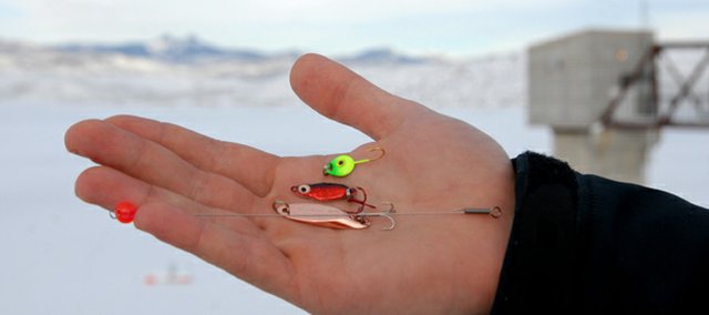Rich King, an avid ice fisherman and owner of Auto Parts of Craig, keeps a handful of go to lures on hand anytime he treks out for a few hours on the ice including, from top, a green Gem-N-Eye jig, a red Frostee Spoon, and a copper KastMaster. Because fish tend to bite softly during the winter months no outfit is complete without a strike indicator, shown at bottom.
