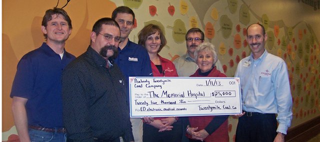 Employees of Peabody Energy present Friday officials of The Memorial Hospital in Craig and members of The Memorial Hospital Foundation with a $25,000 donation for Electronic Medical Record software for the emergency room department at TMH. Accepting on behalf of the hospital were Bryan Chalmers, TMH CFO; Bonnie Hampton, TMH Foundation vice chairperson; and Kim White, ED manager.