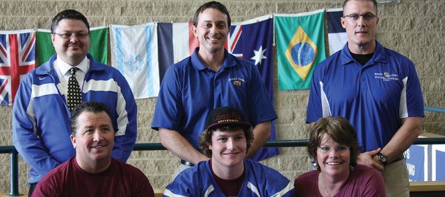 Michael Samuelson, a senior at Moffat County High School, will play football at Colorado Mesa University next year. He signed with the school Wednesday, along with his parents, Mark and Shannon (front) and (back row, from left) Moffat County School District Athletic Director Jeff Simon, head football coach Kip Hafey, and assistant coach Lance Scranton.