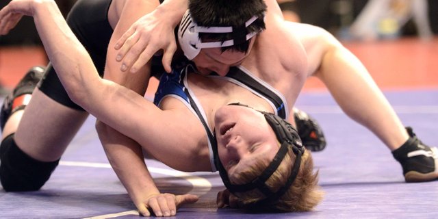 Moffat County’s Jesse DeMoor wrestles Friday at the state tournament in Denver. Although he lost in the championship quarterfinals early Friday, he earned a quick first-period pin of his first consolation round opponent. He’ll wrestle today in the consolation semifinals of the 182-pound Class 3A bracket.