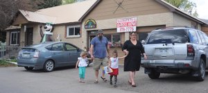 Liana Del Herro and her daughter Ava along with Mike Killingsworth and his daughter Addison leave the Laurel Street Preschool on Wednesday afternoon. Parents were informed Tuesday that the school would be closing Wednesday in the wake of a state inspection report that revealed numerous violations. A meeting for the board to address families is at 5:30 p.m. Thursday.