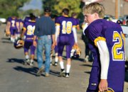 Little Snake junior Sean Rietveld walks off the field with his teammates after the Rattlers' loss to the Miners.