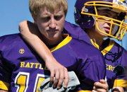 Skyler Lee, left, and Conner Lee watch the junior varsity game before they take the field. Little Snake closed for the day so students could attend the homecoming parade and watch the junior varsity and varsity teams play their first home game in 56 years.