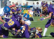 Rattlers defenders swarm the Miners' offense late in the game. Little Snake fans stayed strong in their devotion, even during the final minutes when the scoring deficit ballooned past 30 points.