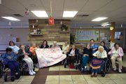 The residents at Sandrock Ridge Care & Rehab donated a quilt Tuesday to the Yampa Valley Pregnancy Center. The quilt, which is one of the activities residents participate in and took about two years to complete, will be given to a baby girl.