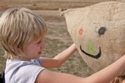 Zoey Patterson, 11, decorates a scarecrow face during the Boys & Girls Club of Craig afternoon excursion to the Wyman Museum.