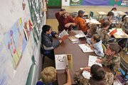 David Gaines explains how workers made the Chunnel between France and England during a literacy class Thursday. The book "Through a Mountain and Under a Sea" combined math, history and reading into one lesson.