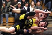 Moffat County High School’s Nick Chew grapples with Meeker’s JR Crawford on Friday during the 171-pound match of a dual at Meeker High School. The Bulldogs won the dual, losing only one match.