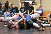 Moffat County’s Cody Adams fastens a headlock on Meeker’s Collin Cochran moments before a pin 35 seconds into their match Friday in Meeker. Adams placed sixth in last year’s regionals and hopes to improve on that to make it to the state tournament this season.