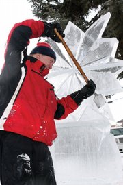Michael Campe uses a flat ice chisel to form a snowflake ice sculpture to be featured at Alice Pleasant Park. Campe, who has been creating ice sculptures for 25 years, was the Colorado team captain at the 1990 Ice Sculpture World Championships in Ontario, Canada. The team represented the United States at the international event and took fourth place.