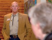 Bob McConnell listens to a question at a reception for delegates to the Republican county assembly at Creekside Cafe & Grill on Monday evening.