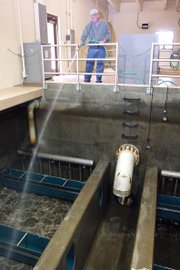 Plant operator Scott Price hoses down sediment from sections of filter no. 6 on Friday at the Craig Water Plant. Each filter is cleaned after about 40 hours of use. The amount of particles in the water fluctuates seasonally with the Yampa River water flow, this time of year being the dirtiest.