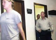 Ken Johnson, a former Craig Police Department detective, follows Tausha Merwin on Tuesday into Moffat County District Court for his sentencing hearing. Johnson pleaded guilty in April to attempting to influence a public servant, a Class 4 felony. He was sentenced to seven days jail, 53 days work release, 150 hours community service and two years probation.