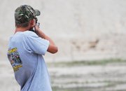 Justin Willems, 17, shoots at targets from the standing position during the .22 rifle competition at the 200 National 4-H Invitational. Willems placed eighth overall out of 76 shooters.