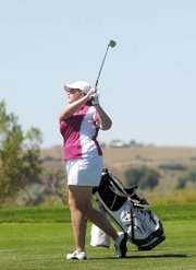 Amber Nicholson watches her drive soar Sunday at Yampa Valley Golf Course. Nicholson won the women’s club championship for the second year in a row by shooting a combined 155 during the two-day tournament.