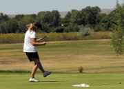 Susan Nicholson celebrates after sinking a long put on the 18th hole at Yampa Valley Golf Course. Nicholson finished third in the women’s club championship, with a two-day score of 171. Nicholson’s daughter, Amber, finished first with a score of 155.