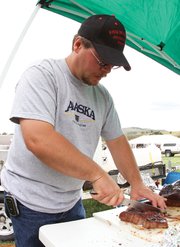 Adrian Nelson, of Craig, prepares his brisket a few moments before turning it in for judging Saturday during the Colorado BBQ Championship at the Wyman Museum. Nelson earned fourth place honors in the chicken category.