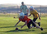 Bronc Hellander dives for a fumble during a Craig Parks and Recreation fifth- and sixth-grade Doak Walker football game Tuesday at Woodbury Sports Complex. The Bengals beat the Steelers 19-0.
