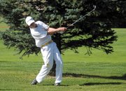 Battle Mountain’s Michael Wilhelm takes a swing on the 10th hole Thursday at Yampa Valley Golf Course. Wilhelm, a sophomore, hit a hole-in-one on the seventh hole during the Moffat County High School boys varsity golf team’s home tournament.