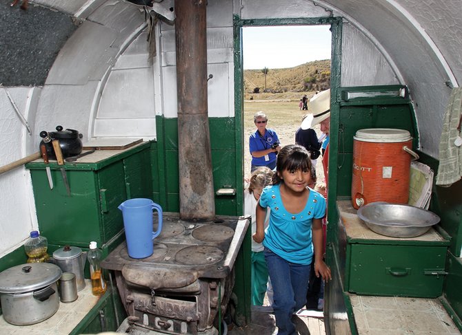 ofelia quezada 7 enters a sheep wagon during the 12th annual craig sheep wagon